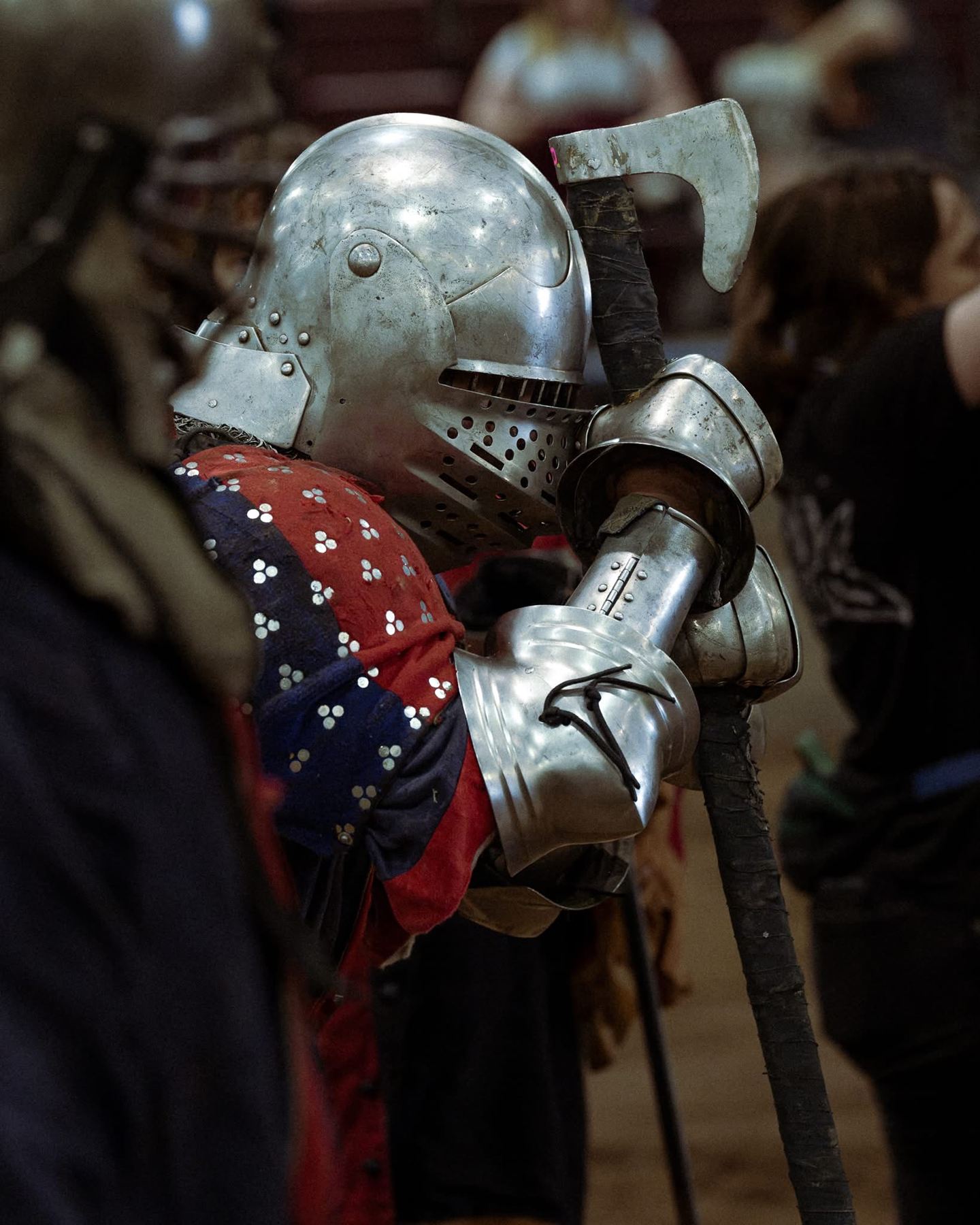A Dragoon leaning on a pollaxe between fights