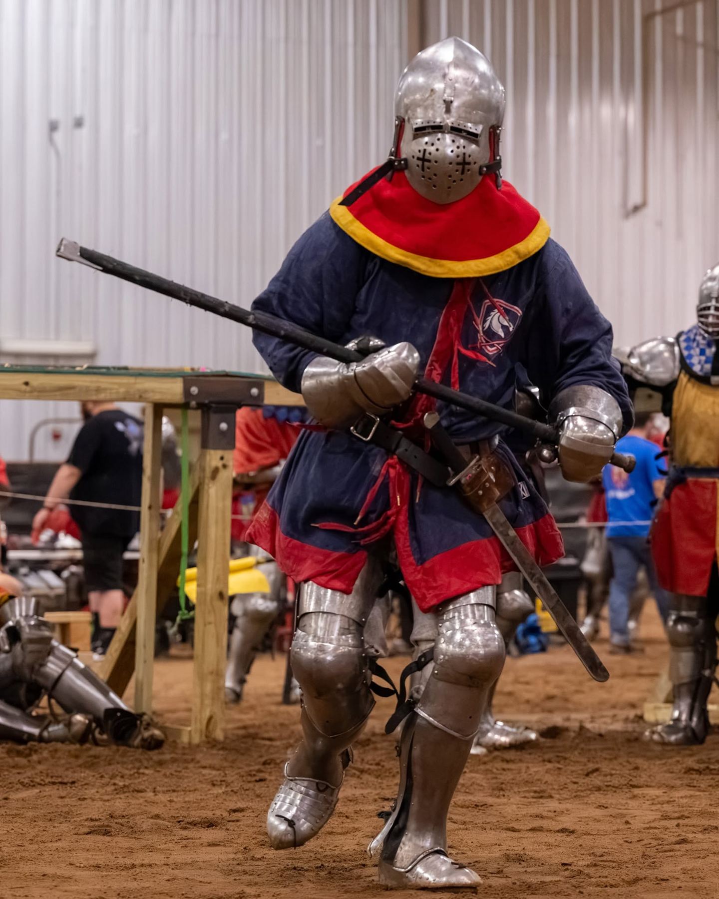 A Dragoon advancing across the dirt with a polearm